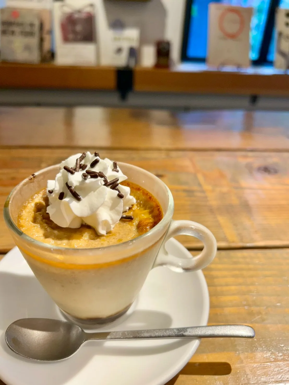 Photo by August Moon Cafe on July 02, 2026. May be an image of cappuccino, whipped cream, tiramisu and text.