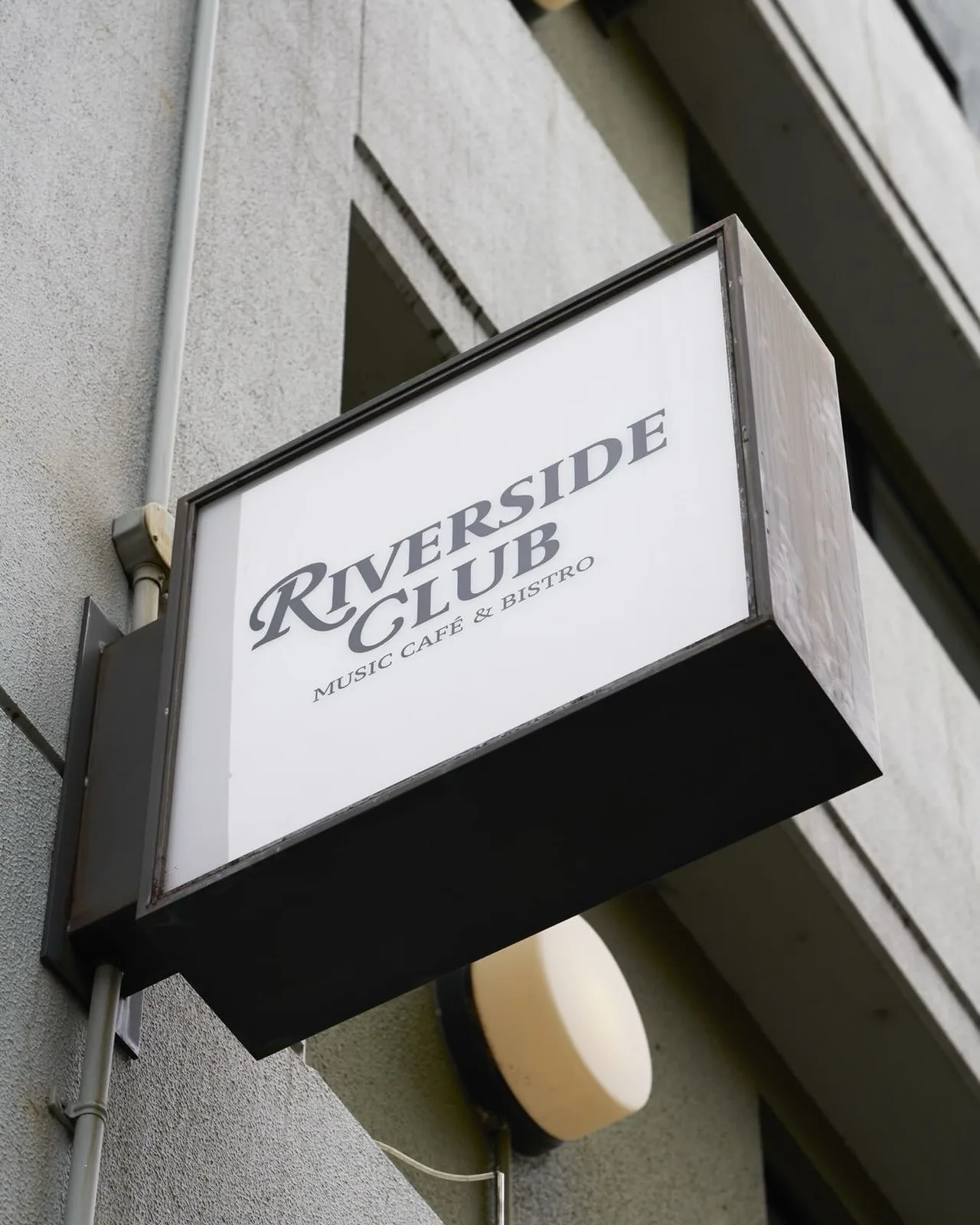 Photo by RIVERSIDE CLUB | リバーサイドクラブ中目黒 in RIVER SIDE CLUB. May be an image of signboard and text that says 'RIVERSIDE RIVERSIDE Ky4OBИ GLUB & UB BISTRO BISTRO CAFE MUSIC MUSIC'.