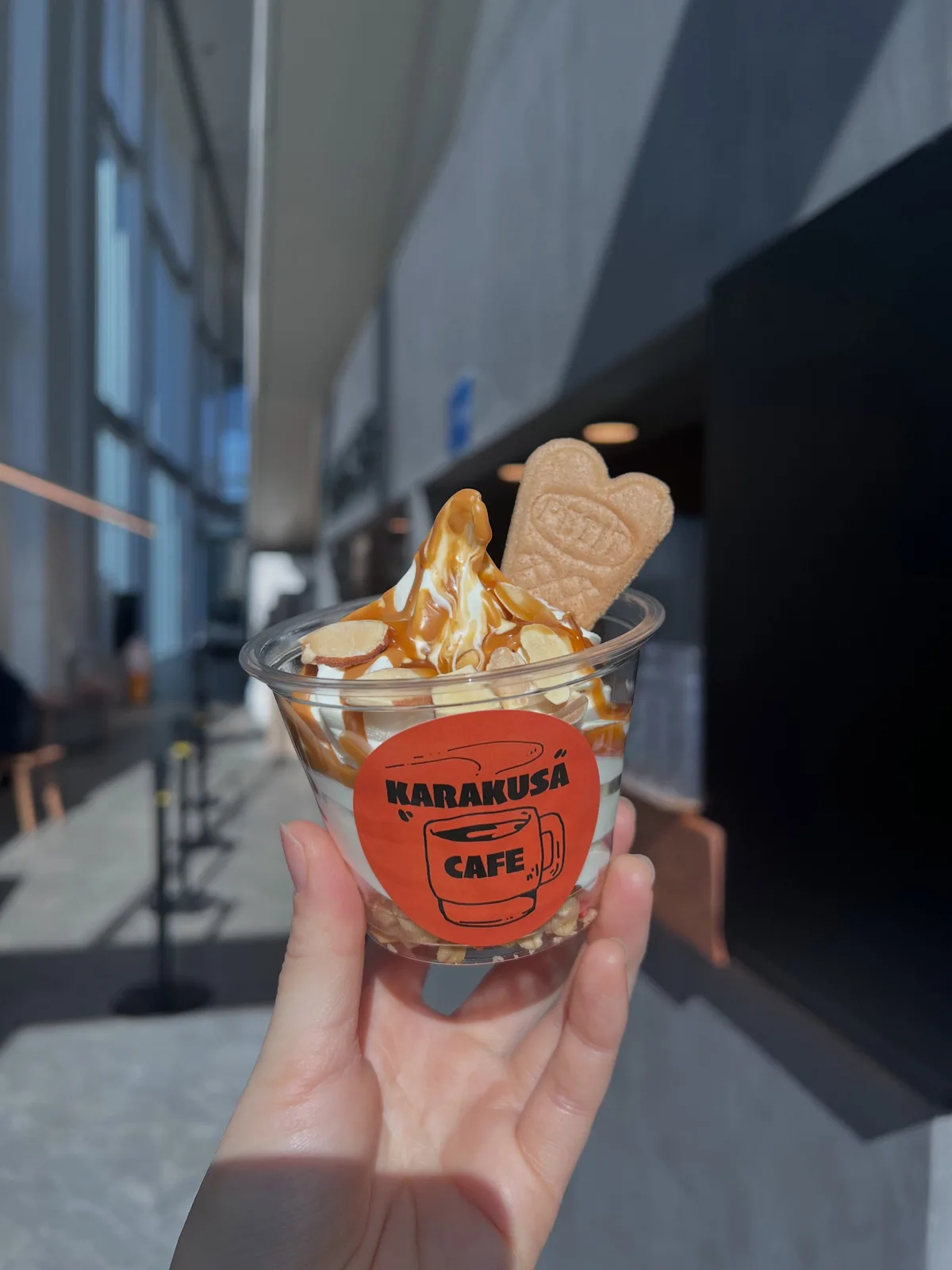 Photo by KARAKUSA CAFE in 日本体育大学 / Nippon Sport Science University. May be an image of gelato, wafer and text that says 'KARAKUSÃ KARAKUS CAFE.! CAFE'.