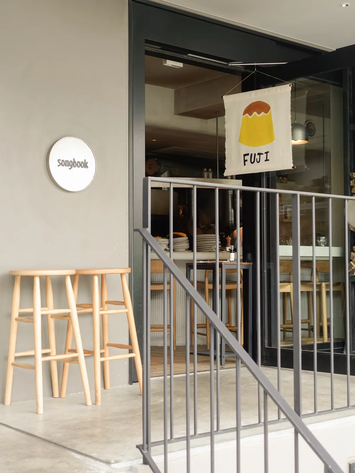 Photo shared by KISSA RAY キッサ レイ on June 03, 2026 tagging @songbook_daita. May be an image of signboard, display case, rack and text that says 'songboak FUJI'.