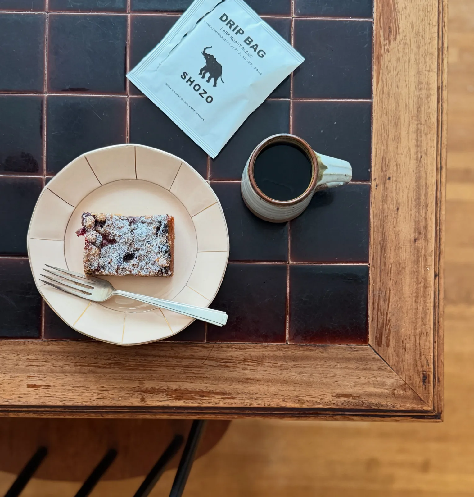 Photo by POPPY on July 31, 2026. May be an image of chocolate bar, coffee cup, tea, napkin, placemat, cornflower and text.