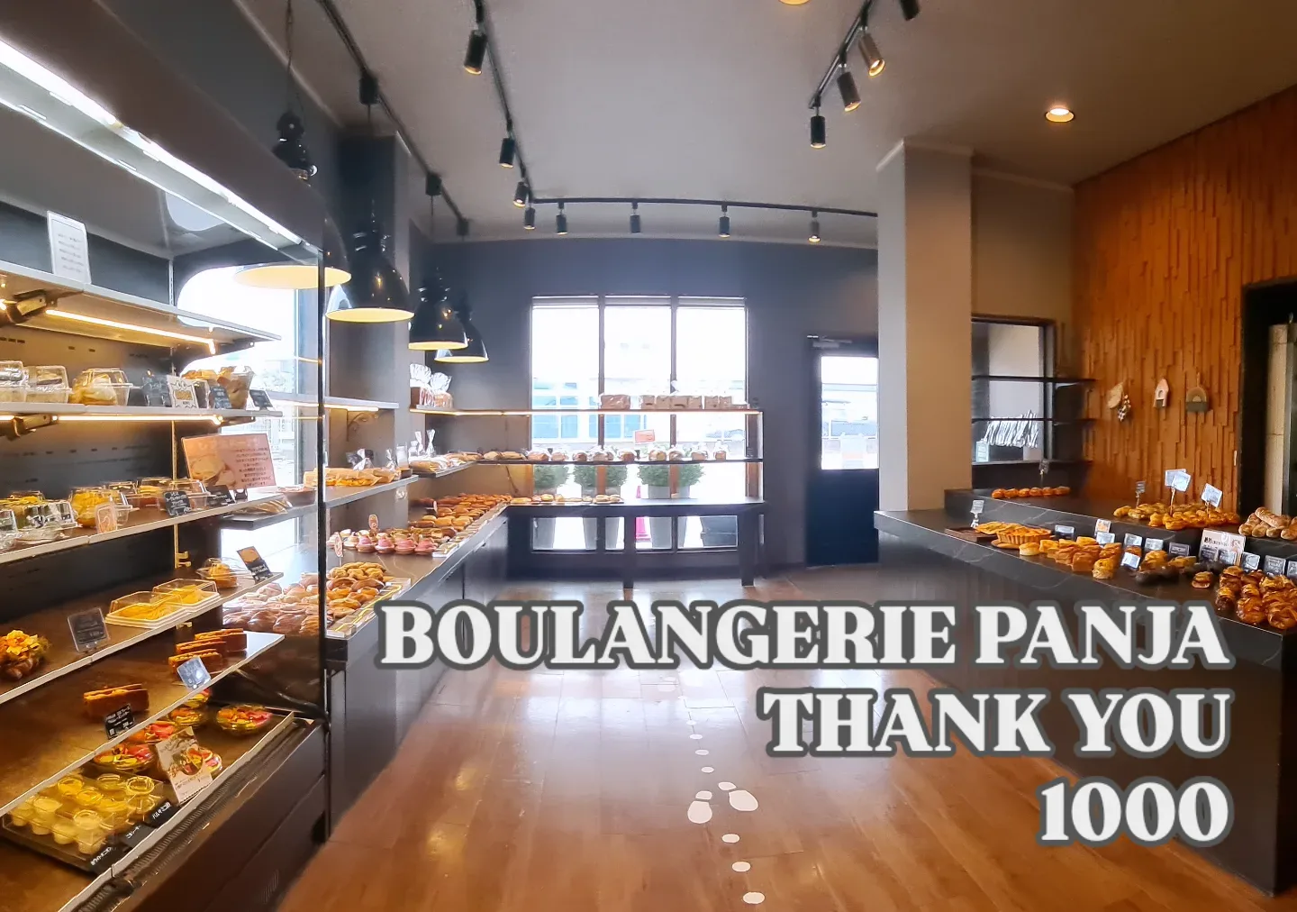 Photo by BOULANGERIE PANJA on June 01, 2026. May be an image of baguette, eclair, display case and text that says 'BOULANGERIE PANJA ΤHΝΚ YOU 1000'.